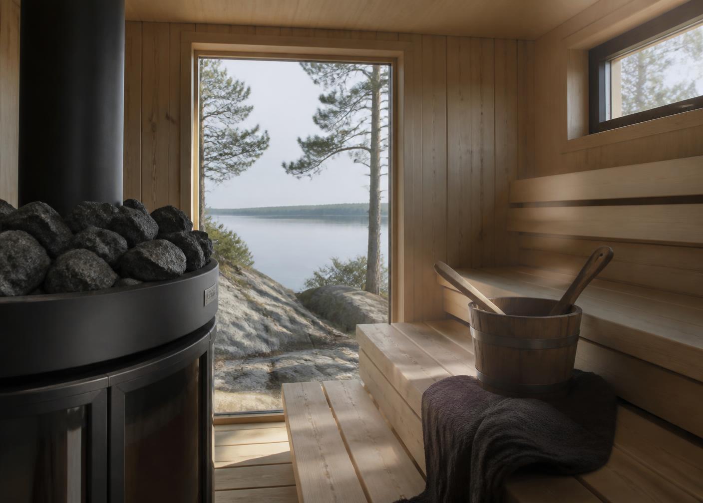 Swedish lakeside sauna with dark stones and pale timber